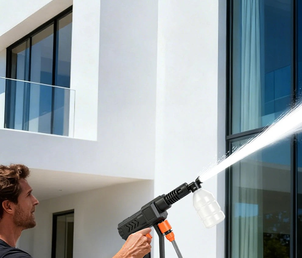 Rinsing house windows with the HydroGo cordless pressure washer